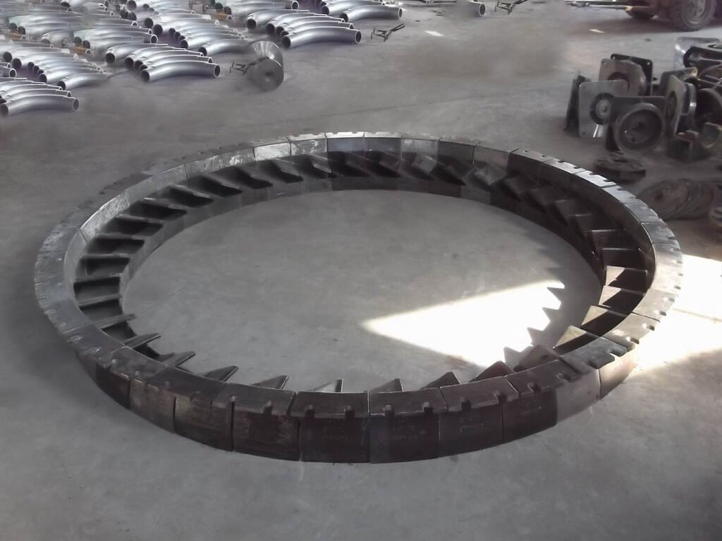 Full circle assembly of 36 high chrome wear rings verifying fit accuracy for hammer mill