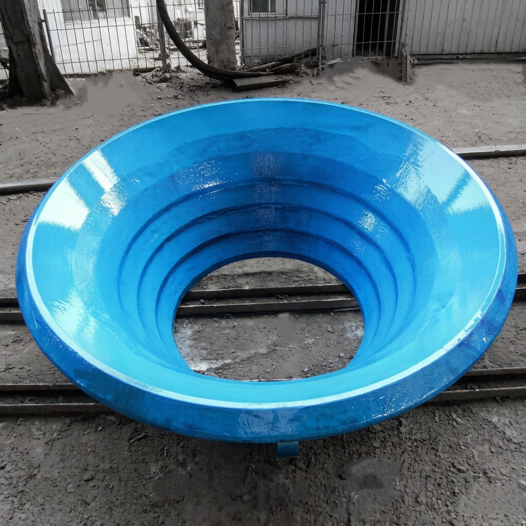 Finished manganese steel cone crusher bowl liner showing concentric groove profile, blue epoxy primer coating